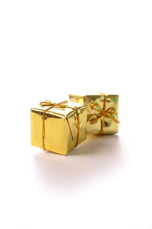 Golden gift boxes on a white backgroundの写真素材