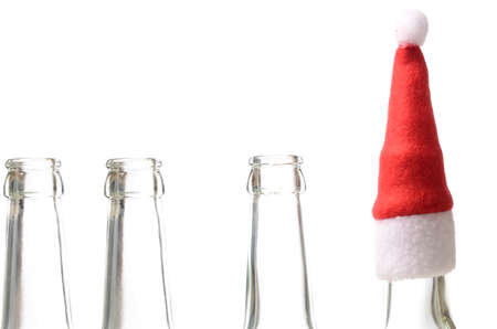 Empty bottles with Santa's hatの写真素材