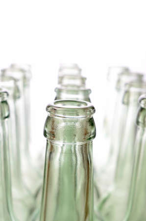 Empty bottles on a white background, selective focus on foregroundの写真素材