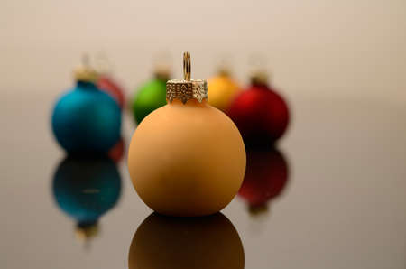 Colorful Christmas baubles with reflectionsの写真素材