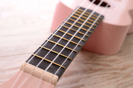 Closeup of a pink ukuleleの写真素材