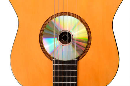 Acoustic guitar with a CDの写真素材