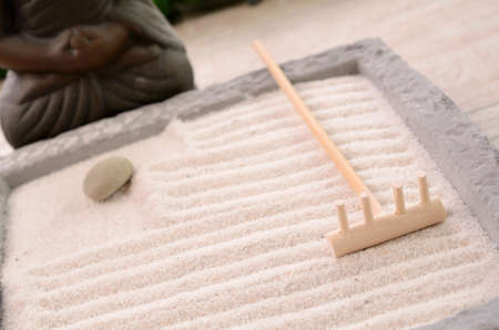 Wooden fork of a small Zen gardenの写真素材