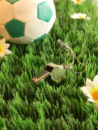 Soccer background with ball and a whistle の写真素材