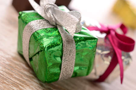 Colorful gift boxes on a wooden background