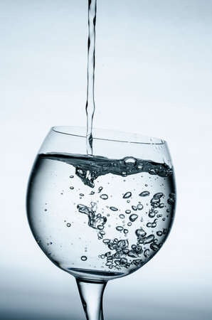 Pouring fresh water in a glassの写真素材