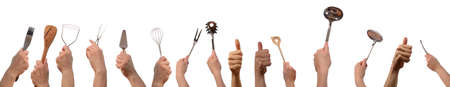 Hands with kitchen tools and thumbs up on a white backgroundの写真素材
