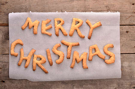 Sweet Merry Christmas background on an old wood plankの写真素材