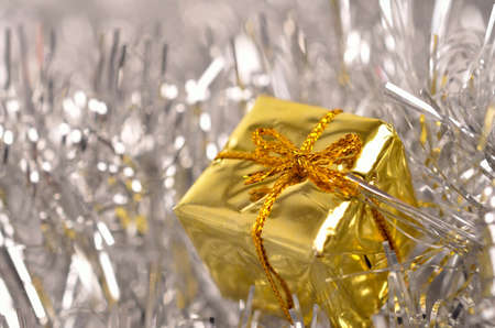 Golden gift box with luxury Christmas decoration in silverの写真素材