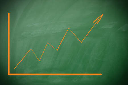 Texture of a blackboard with an upswing arrow, great business conceptの写真素材