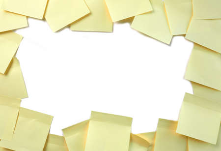 Frame of yellow sticky notes on a white backgroundの写真素材