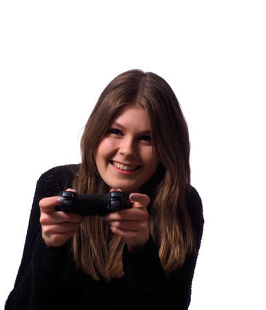 Young woman playing video games and having funの写真素材