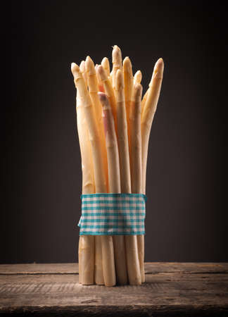 White asparagus on a rustic wooden tableの写真素材