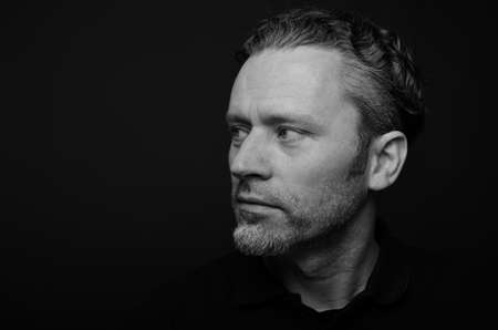 Handsome man on a black backgroundの写真素材