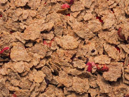 Healthy muesli with dried fruits on a plate, view from aboveの写真素材