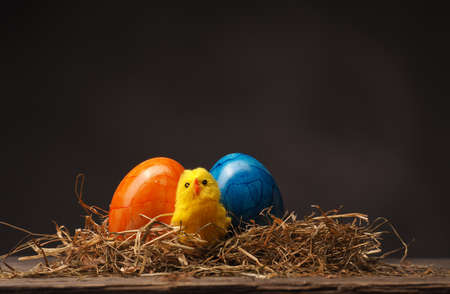 Easter background on an old rustic wooden tableの写真素材