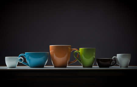 Assortment of a different coffee cups on a tableの写真素材