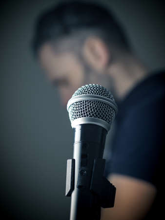 Studio microphone in front of a singer in a studio, selective focusの写真素材