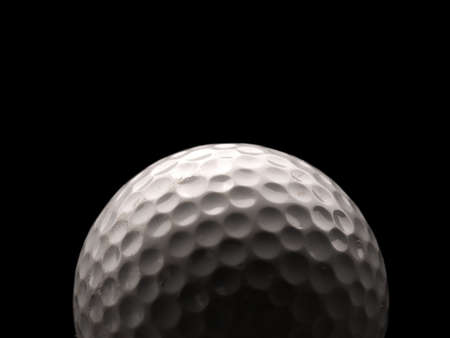 Close up of a used golf ball on a dark backgroundの写真素材