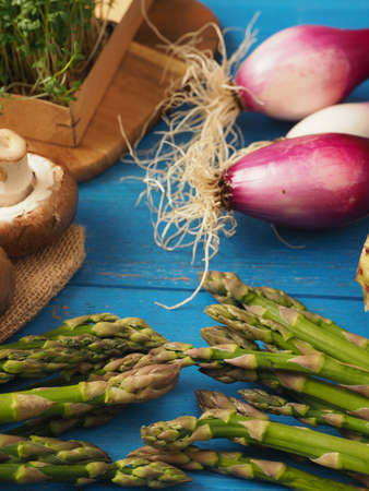 Healthy food concept with organic vegetables on a rustic wooden table, natural light with selective focusの写真素材