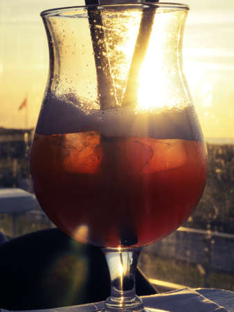 Apple smash cocktail with melon syrup, close up shot on a beach bar at Baltic seaの写真素材