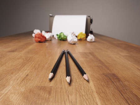 Crumpled paper with an old typewriter on a wooden office desk, creativity concept