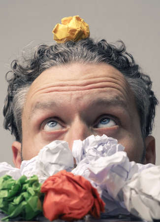 Man have a new idea, concept image with crupled paper