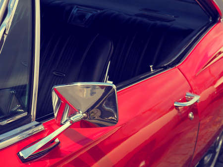 Detail of an old American vintage car on a sunny summer day, lifestyle background retro film stylizedの写真素材