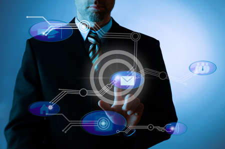 Businessman pointing on a screen, modern communication concept imageの写真素材