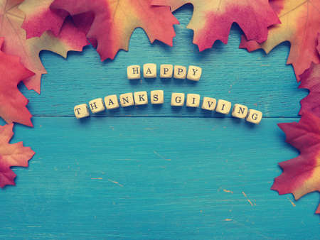 Blue weathered wood with red leaves, seasonal fall backgroundの写真素材