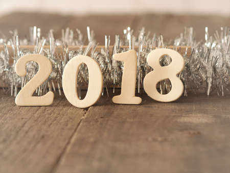 Wooden letters with 2018 on a rustic table with space for text, New Year concept backgroundの写真素材