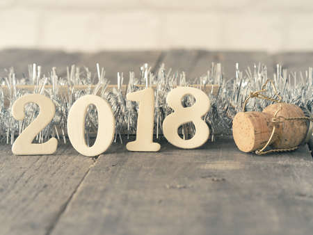 Wooden letters with 2018 on a rustic table with space for text, New Year concept backgroundの写真素材