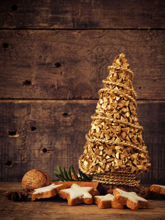 Cinnamon cookies with Christmas decoration on rustic woodの写真素材