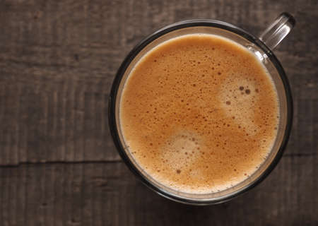 Delicious coffee on a rustic wooden tableの写真素材