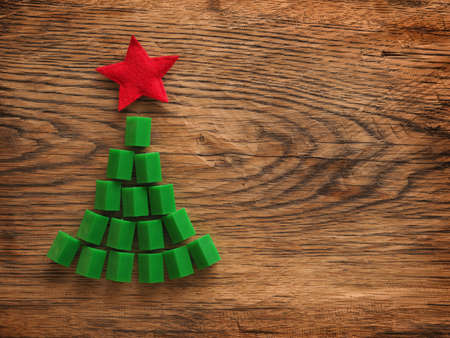 Christmas background with a tree shape on a rustic wooden tableの写真素材