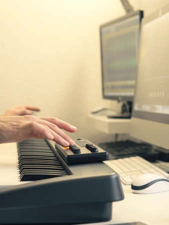 Detail of a music studio with a musician creating a beatの写真素材