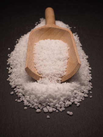 Organic salt on a dark slate board, food conceptsの写真素材