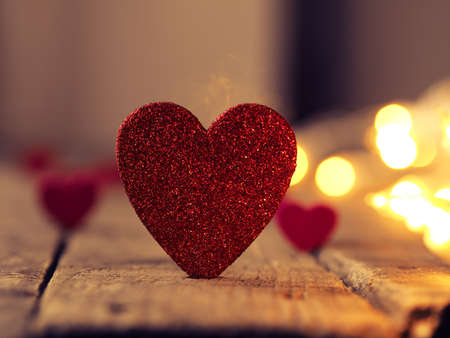 Glittering heart shape with blurred lights, love or Valentines Day concept backgroundの写真素材
