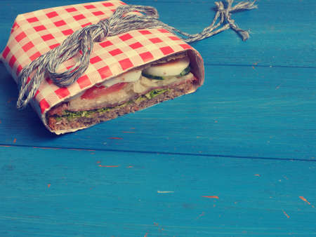 Tasty whole grain sandwich on a blue kitchen table, healthy eating cocneptの写真素材