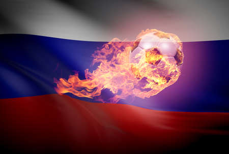 Flying soccer ball with flames on a dark background with the flag of Russiaの写真素材