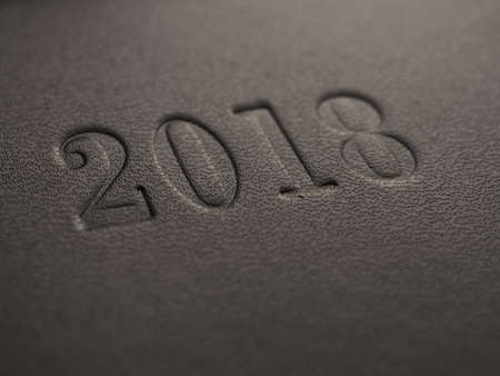 2018 embossed on a dark background with space for text, selective focusの写真素材