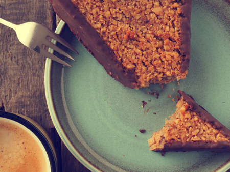 Tasty sweet organic cookies with a cup of coffee on a rustic wooden tableの写真素材