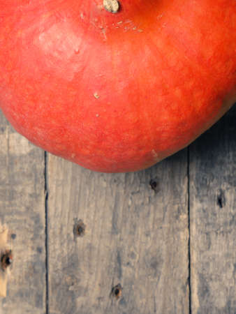 Organic Hokkaido pumpkin on a rustic wooden tableの写真素材