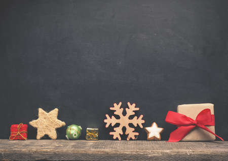 Christmas decoration on a blank chalkboard with space for your text or image