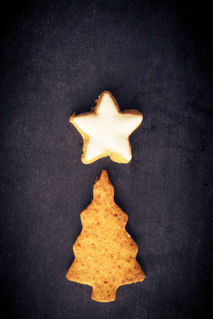 Tasty homemade cookies on a chalkboard, seasonal or Christmas backgroundの写真素材