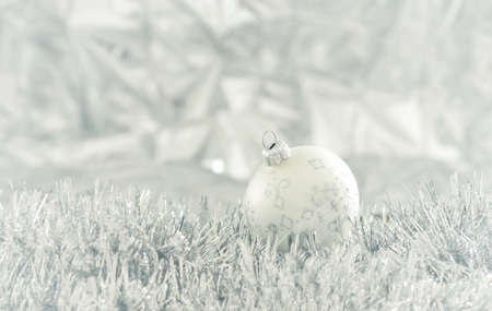 Bright Christmas background with silver decoration and Christmas baubleの写真素材