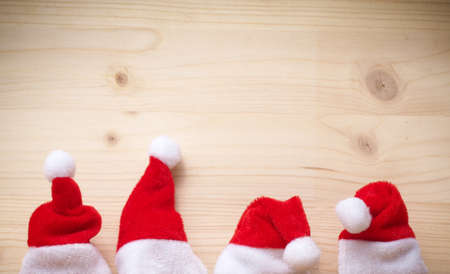 Santa hats on a wooden backgroundの写真素材