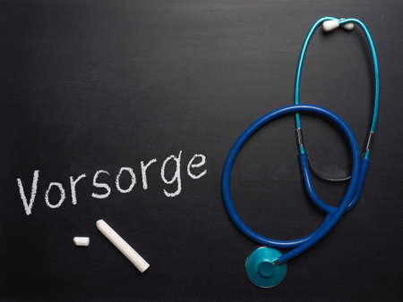 The German word prevention on chalkboard with a stethoscope and space for your text or imageの写真素材