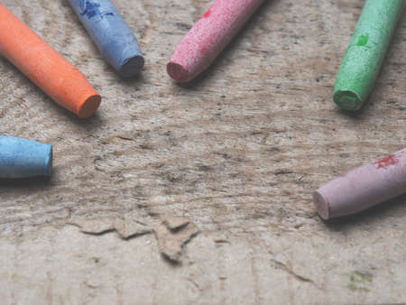 Watercolor pastels on a wooden table with space for textの写真素材