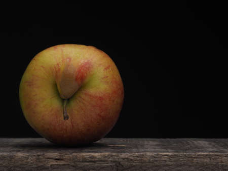 An apple with a big smile, be happy with fresh fruits, healthy eating conceptの写真素材